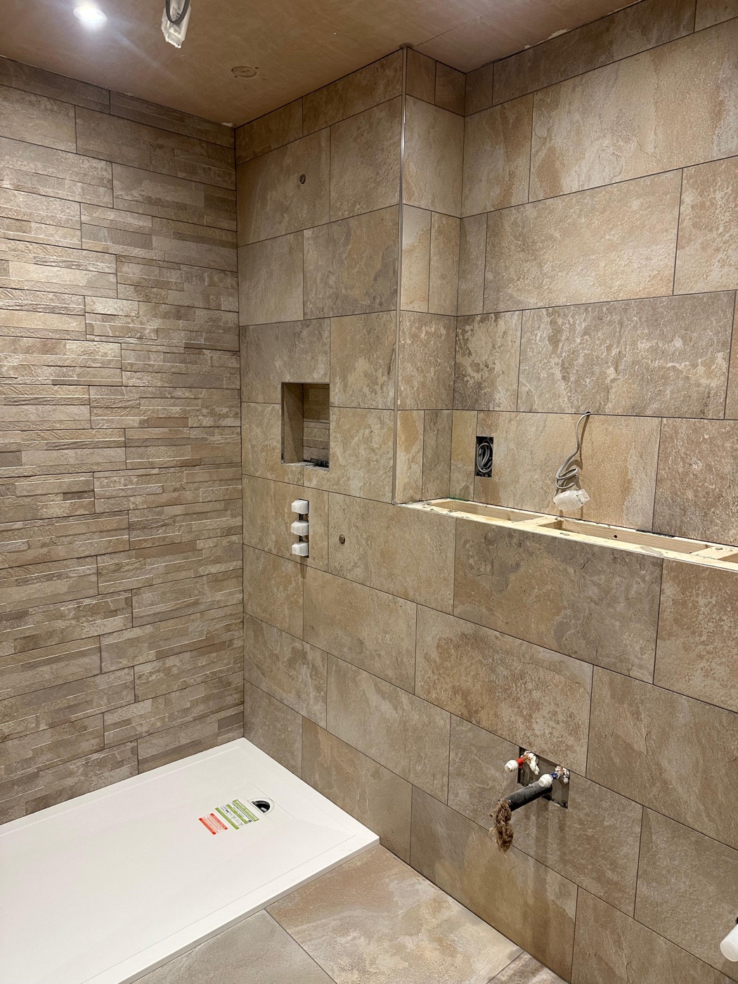 Stone porcelain shower tiling with twin recessed niches, West Wickham — Bromley Tiler