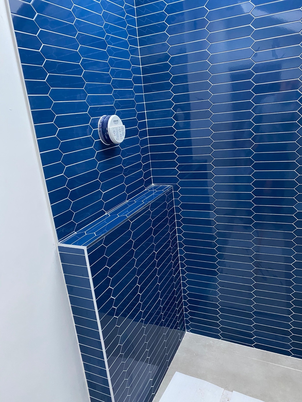 Navy blue hexagon mosaic bathroom tiling with built-in tiled bench seat, Beckenham — Bromley Tiler