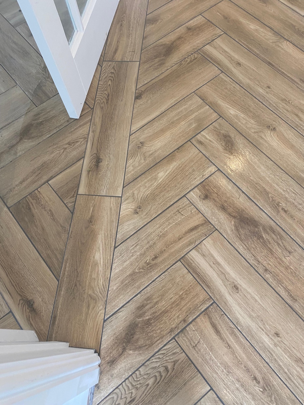 Oak-effect porcelain herringbone hallway floor tiling, Petts Wood, South East London — Bromley Tiler