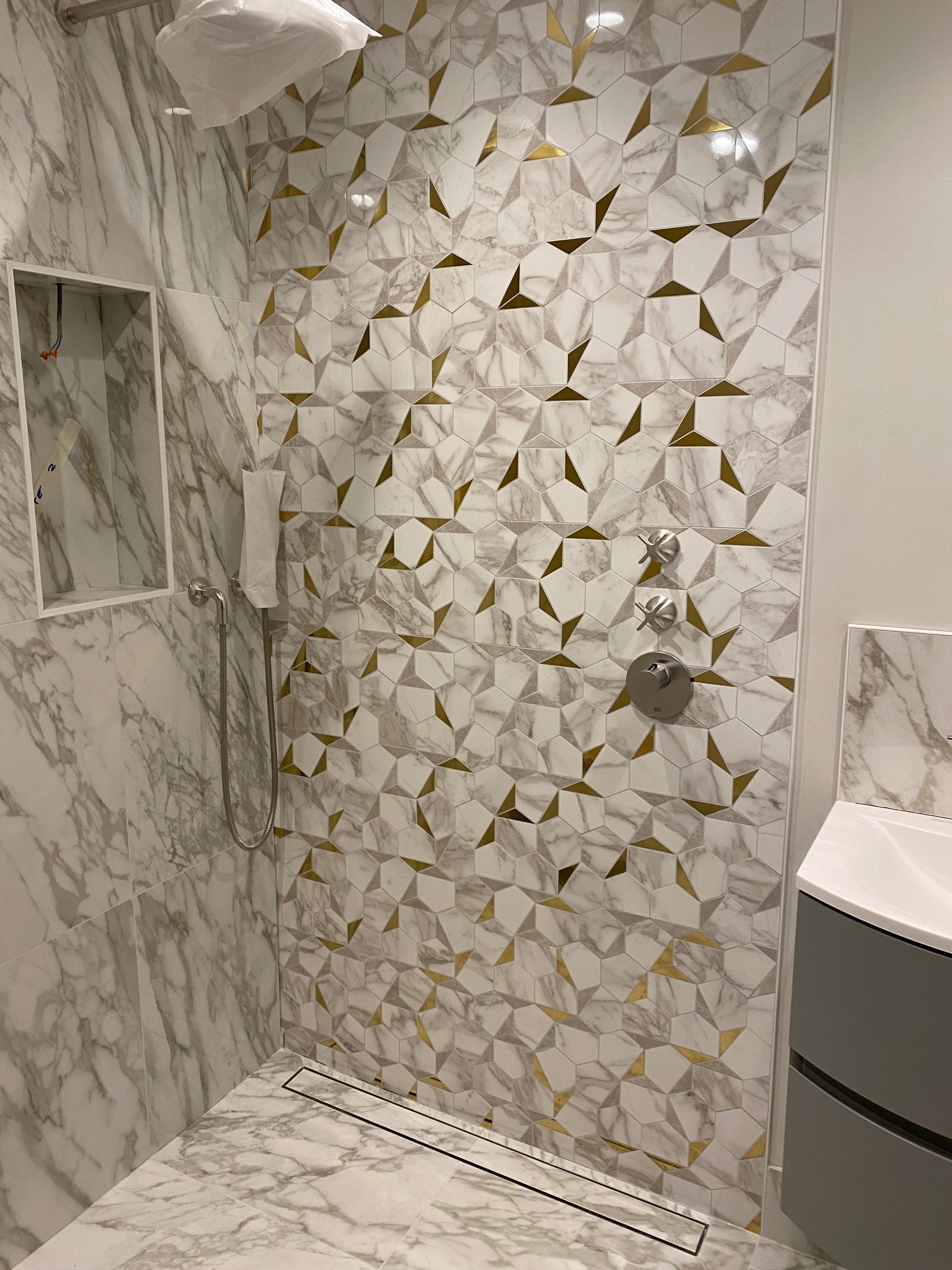 Flawless Calacatta gold hexagon shower tiling with a seamless finish, Bromley, Bromley Tiler