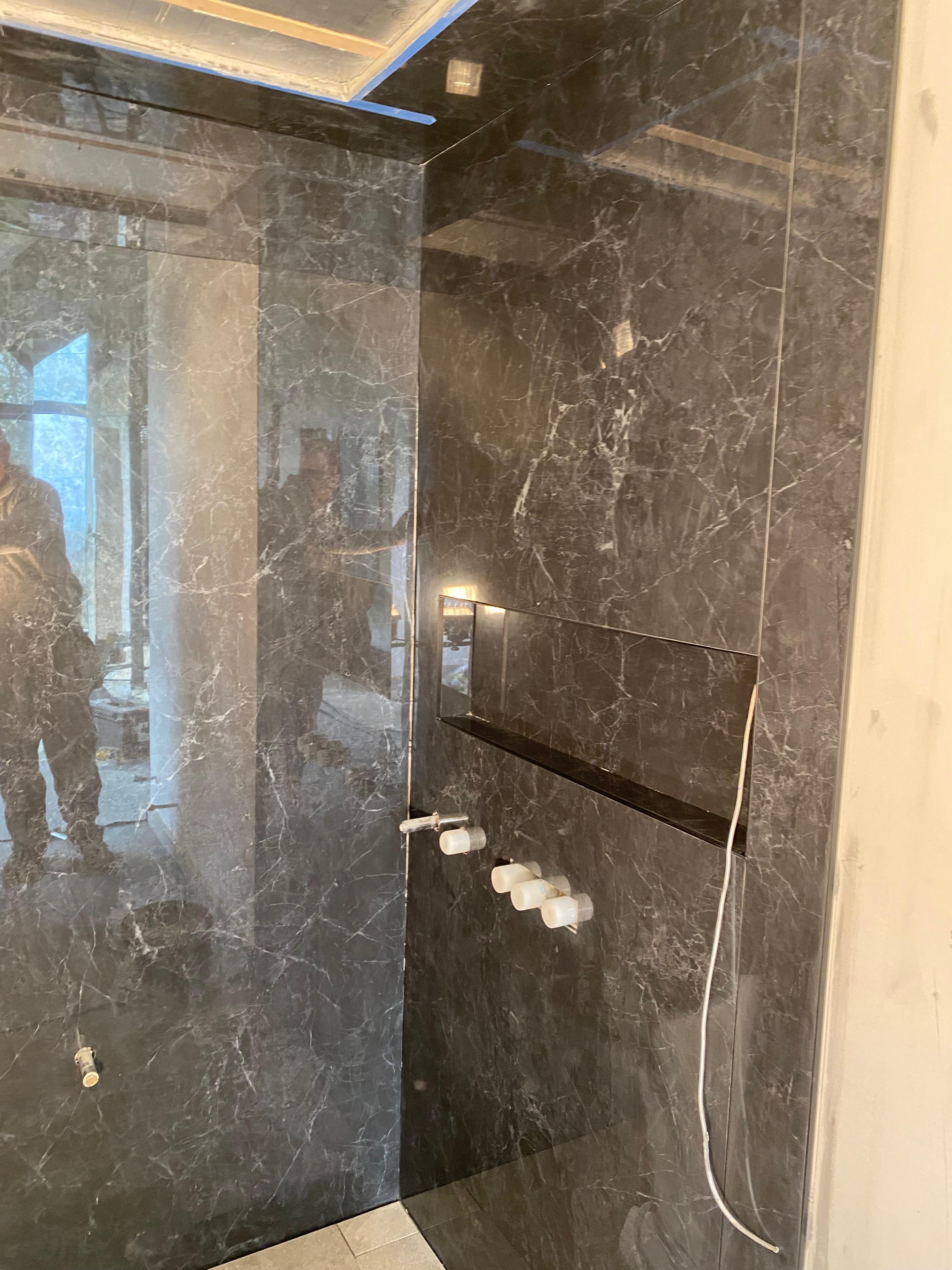 Black Nero Marquina marble wet room with recessed shower niche, Bromley — Bromley Tiler