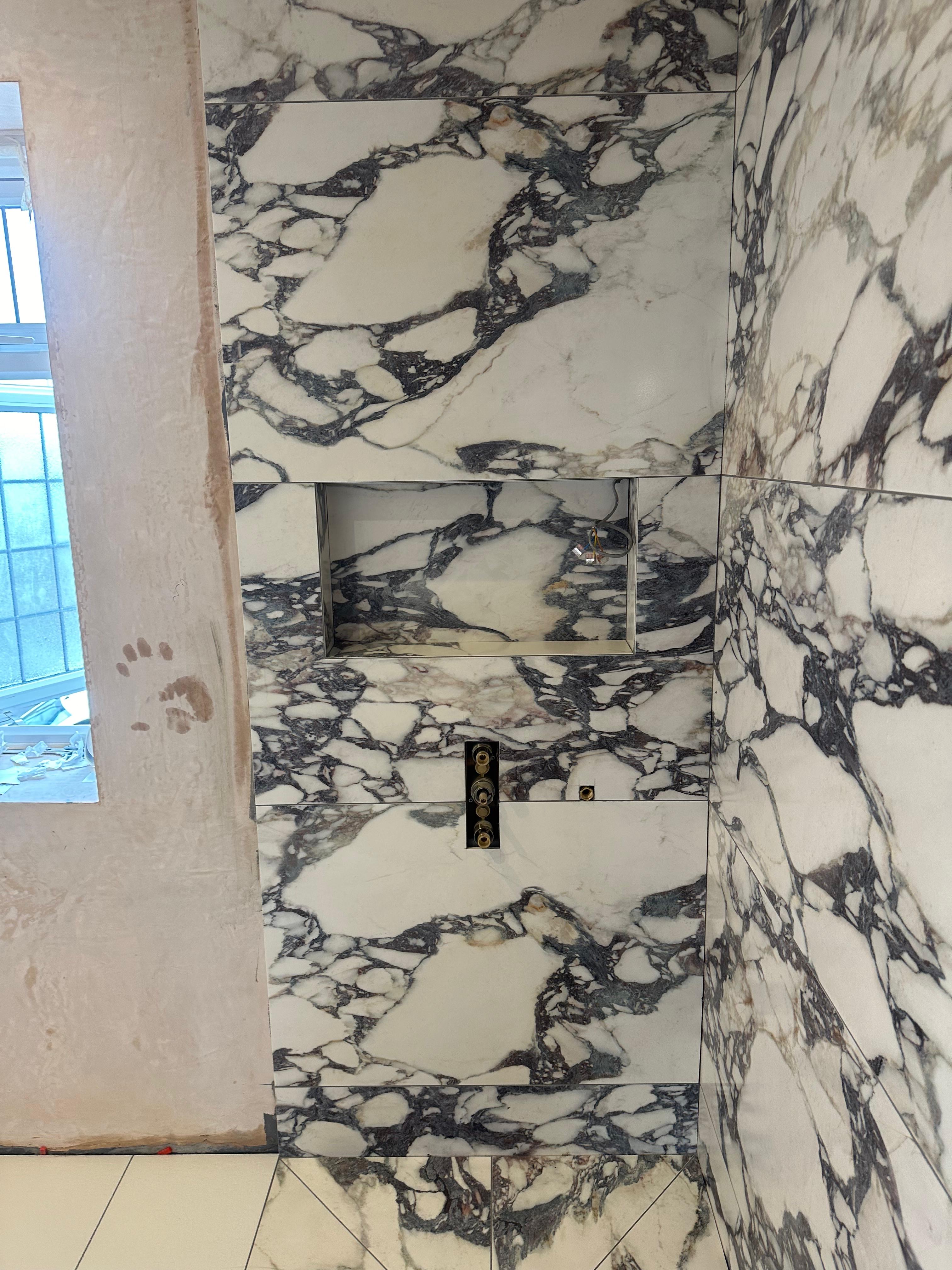 Arabescato marble wet room with a recessed shower niche and dramatic grey veining, Orpington, South East London