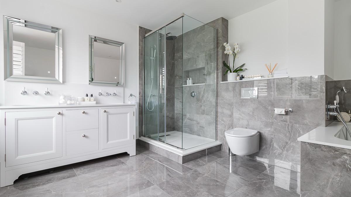 Large-format grey marble-effect porcelain bathroom with corner shower enclosure and double vanity, Bromley, South East London